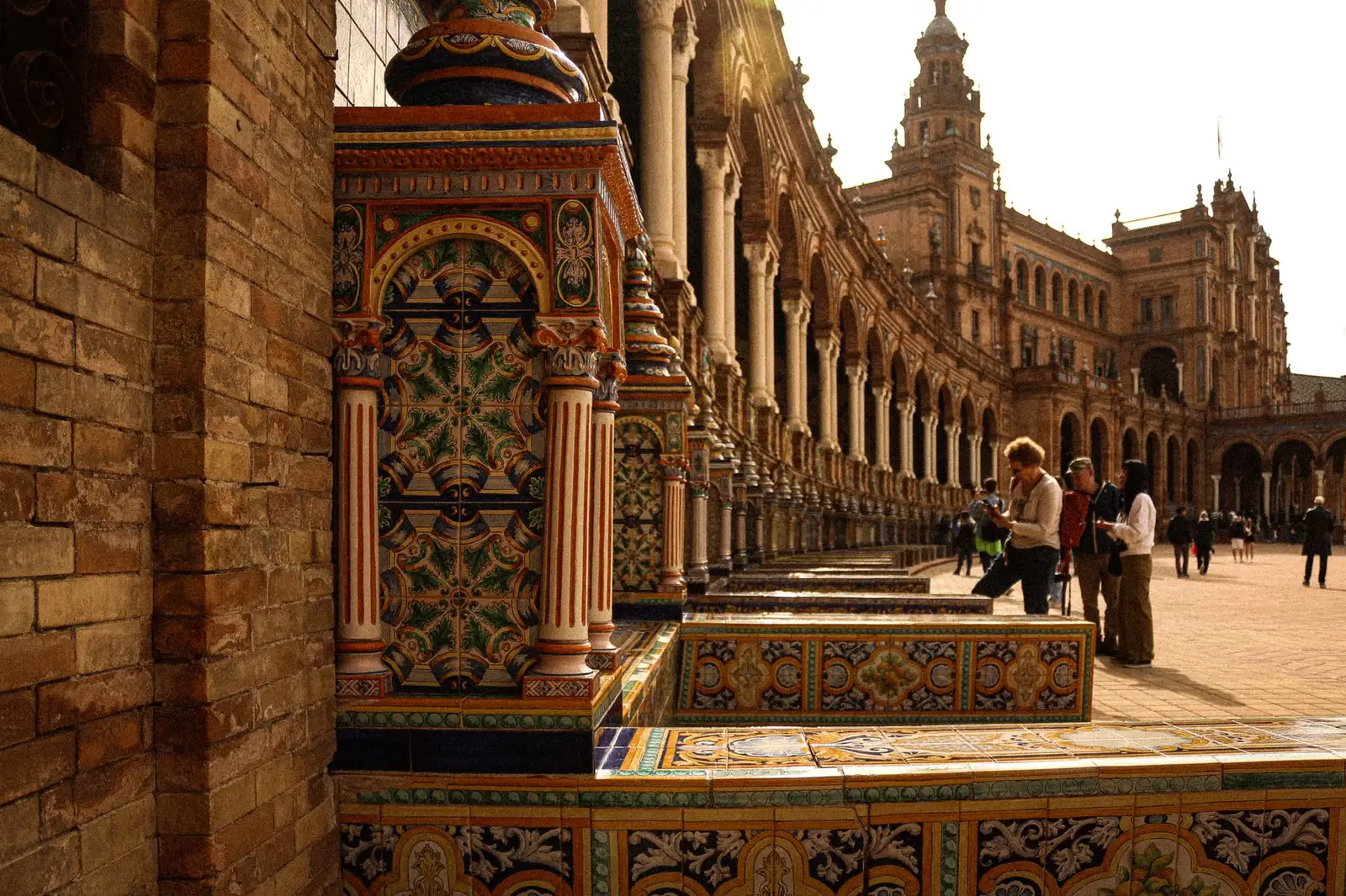 Explore the intricate architecture of Plaza de España in Seville, showcasing vibrant tiles and historical design.